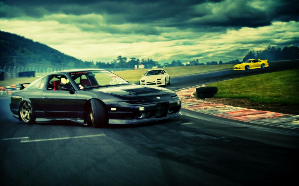 Racing in Full Swing: A Vibrant JDM Aesthetic Captures Three Japanese Beauties Mid-Race Wallpaper