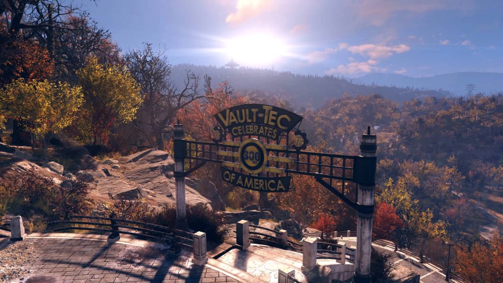 Fallout 76 CGI wallpaper sunrise over autumn Appalachia with Vault-Tec archway on rocky terrain