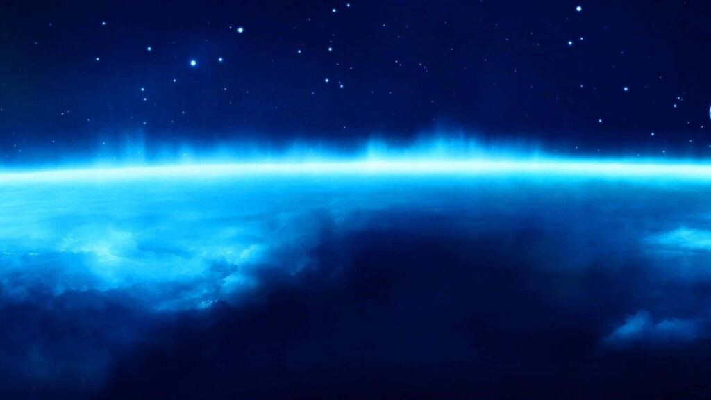 Radiant Blue Star Ocean Wallpaper: Ethereal Cosmic Nebula Background