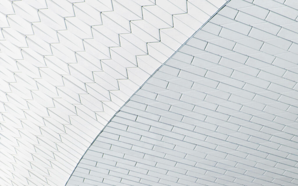 Abstract architectural wallpaper of Sydney Opera House white tiles with geometric chevron patterns