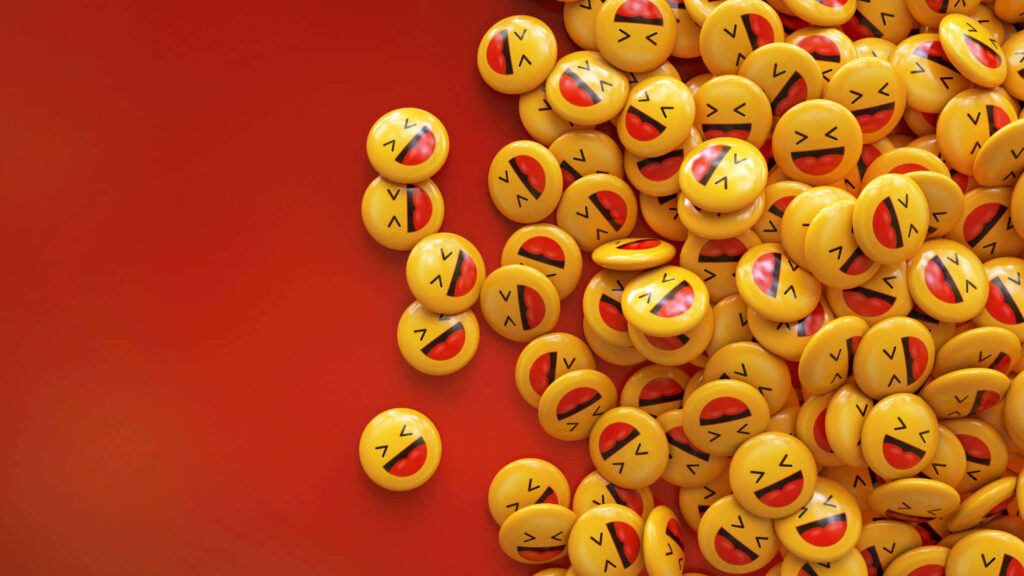 Beaming Emoji Balls Add a Dash of Cheer to Vibrant Red Background! Wallpaper