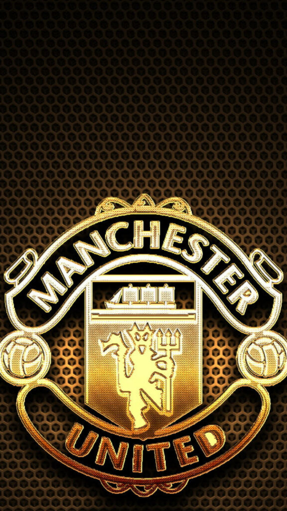 Radiant gold Manchester United emblem on dark textured background bold mobile wallpaper