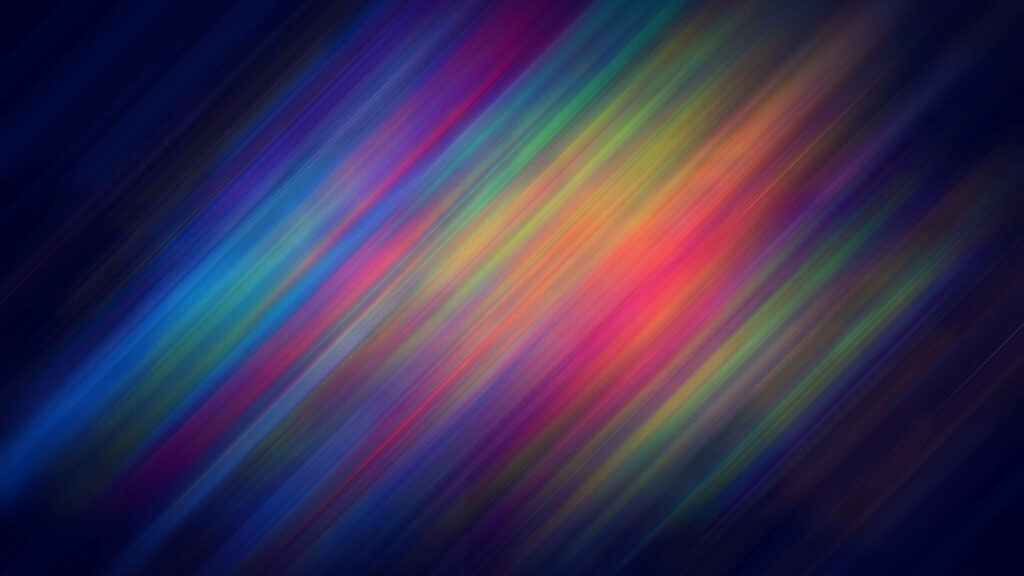 Vibrant diagonal gradient wallpaper with motion blurred light streaks from navy to yellow magenta