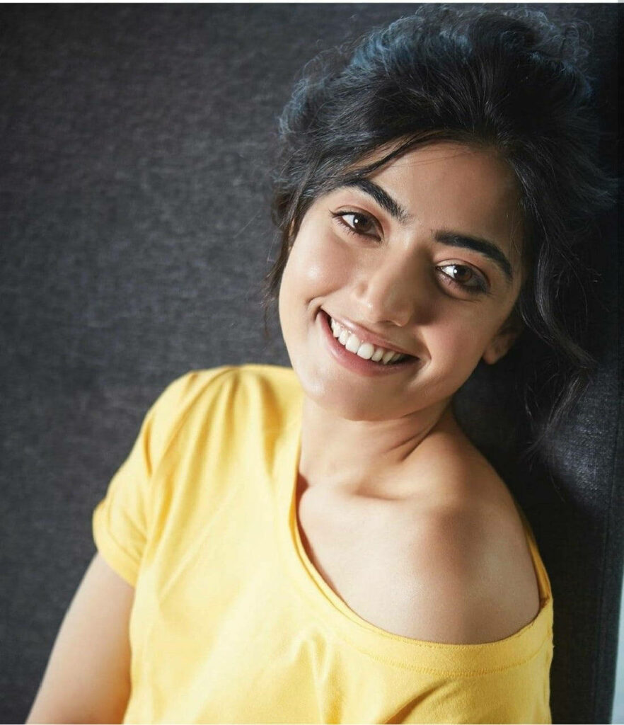 Radiant Rashmika Mandanna Shines in Vibrant One-Shoulder Yellow Ensemble Wallpaper