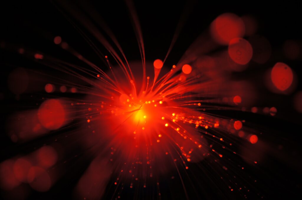 Radiant Red Abstract Wallpaper with Energetic Design & Glitter Effect