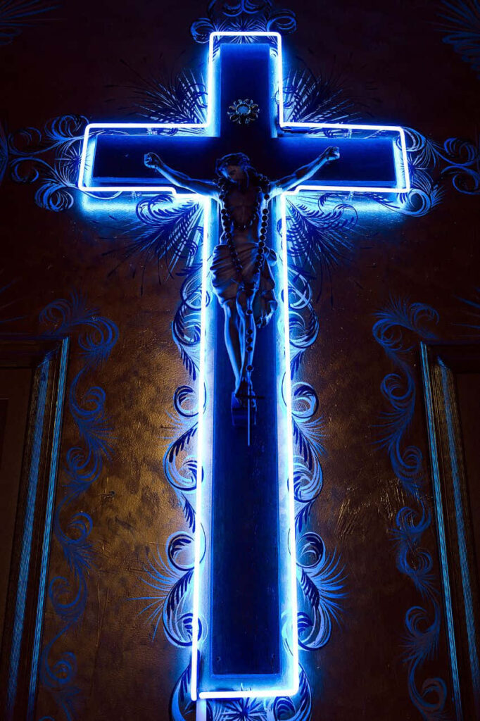 Radiant Redemption: A Neon Blue Jesus Wallpaper