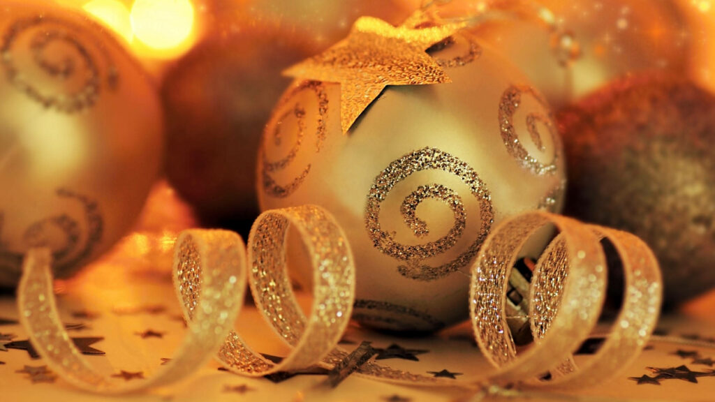 Glowing Christmas wallpaper with delicate ornaments and soft lights - festive and elegant background.