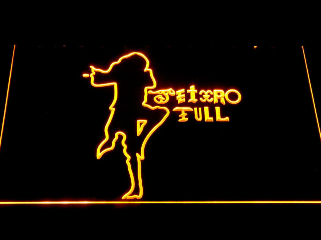 Neon Thrills: Illuminating Jethro Tull's Iconic Logo on a Black Canvas Wallpaper