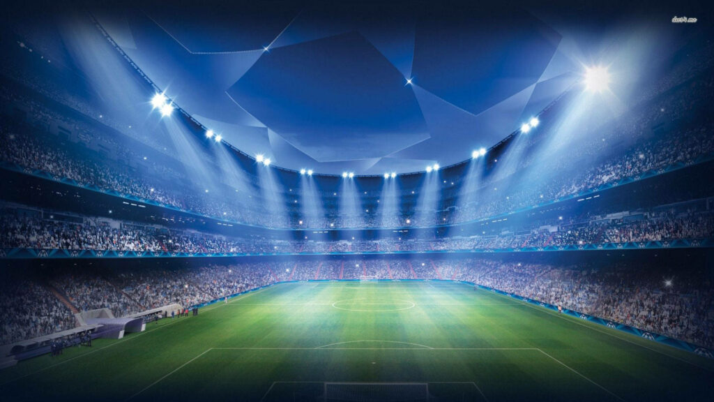 Glowing Spectacle: A Sports Haven Overflowing with Soccer Fans in Majestic Stadium Wallpaper