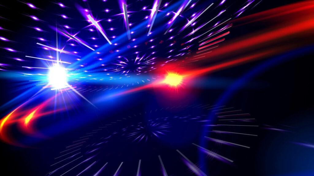 Dazzling Red and Blue Light Show: Mesmerizing Patterns and Vibrant Streaks Reflect on Desktop Wallpaper