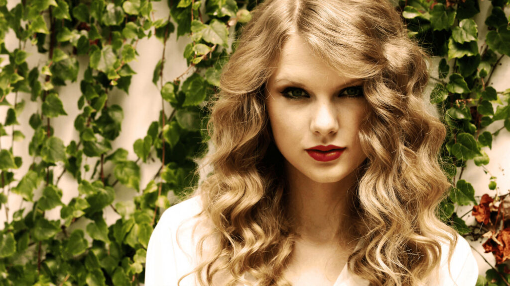 Radiant Taylor Swift: The Beautiful Cascading Curls Wallpaper for Any Occasion