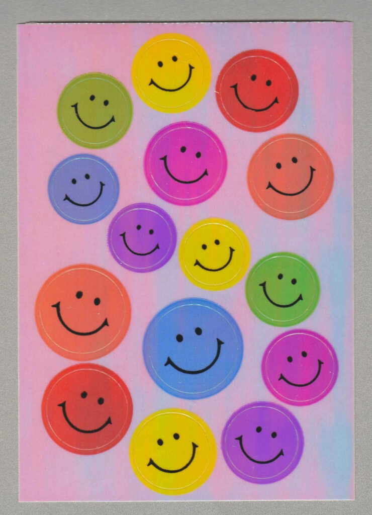 Vibrant Preppy Smiles: Delighting in Colorful Smiley Faces Against a Playful Pink Frame Wallpaper