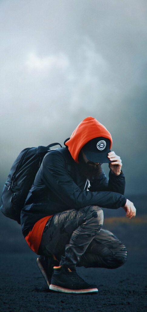 Rebel Spirit: Vibrant HD Phone Wallpaper Depicting a Cool Boy's Attitude