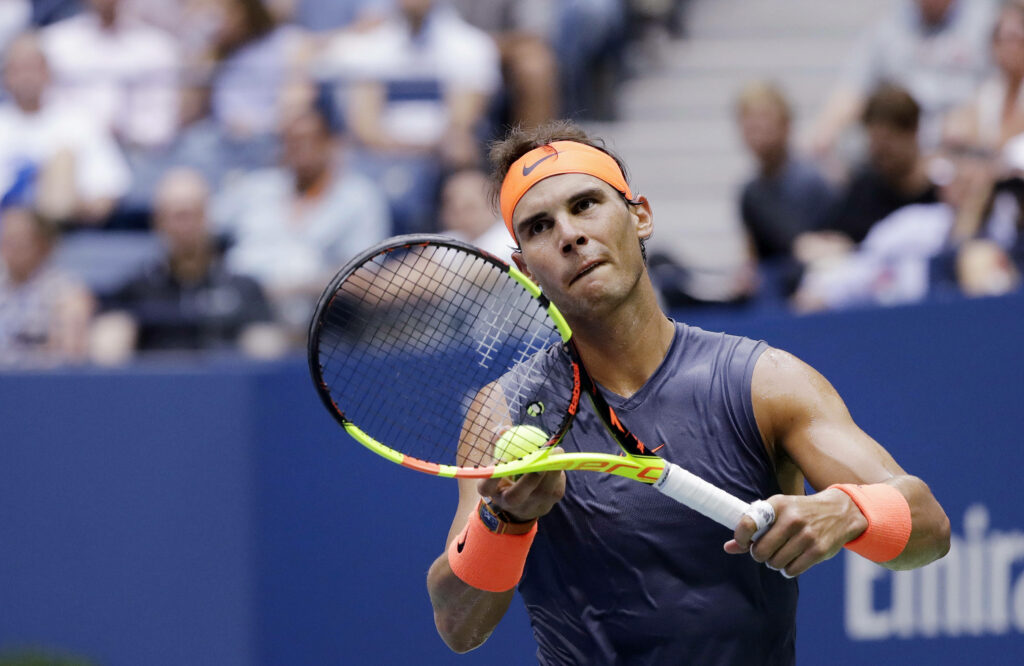 Rafael Nadal: Focused & Ready to Serve - Intense Tennis Wallpaper