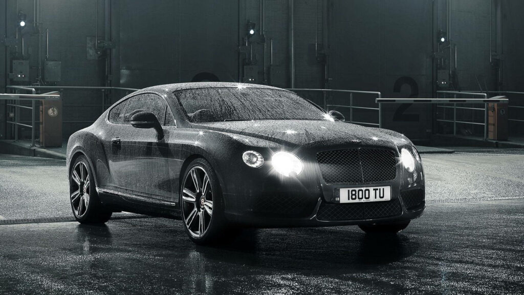 Rainy Night Elegance: Black Bentley Continental GT Shines with Open Headlights Wallpaper