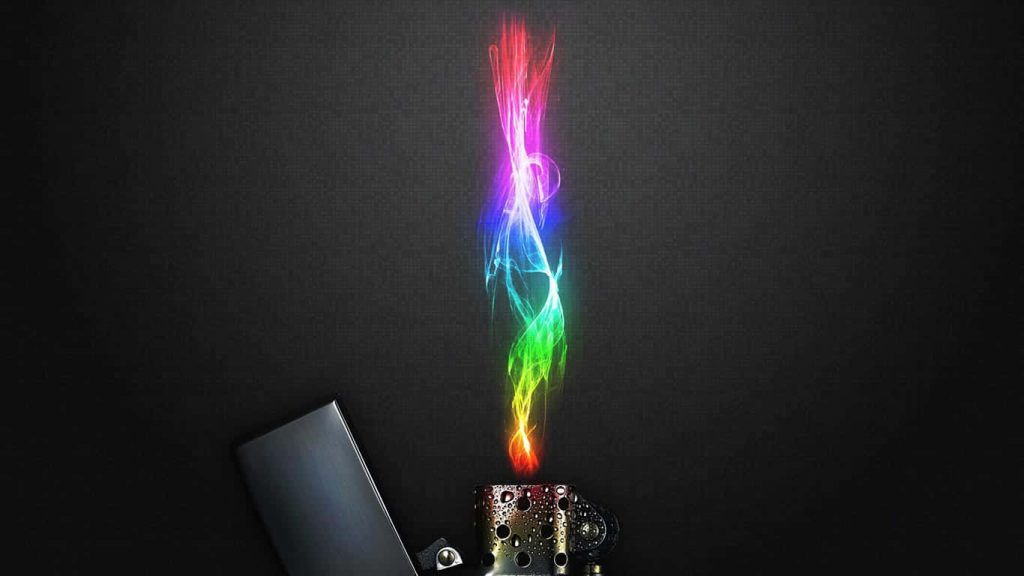 Abstract digital wallpaper of metallic perforated object with vibrant rainbow smoke on dark background