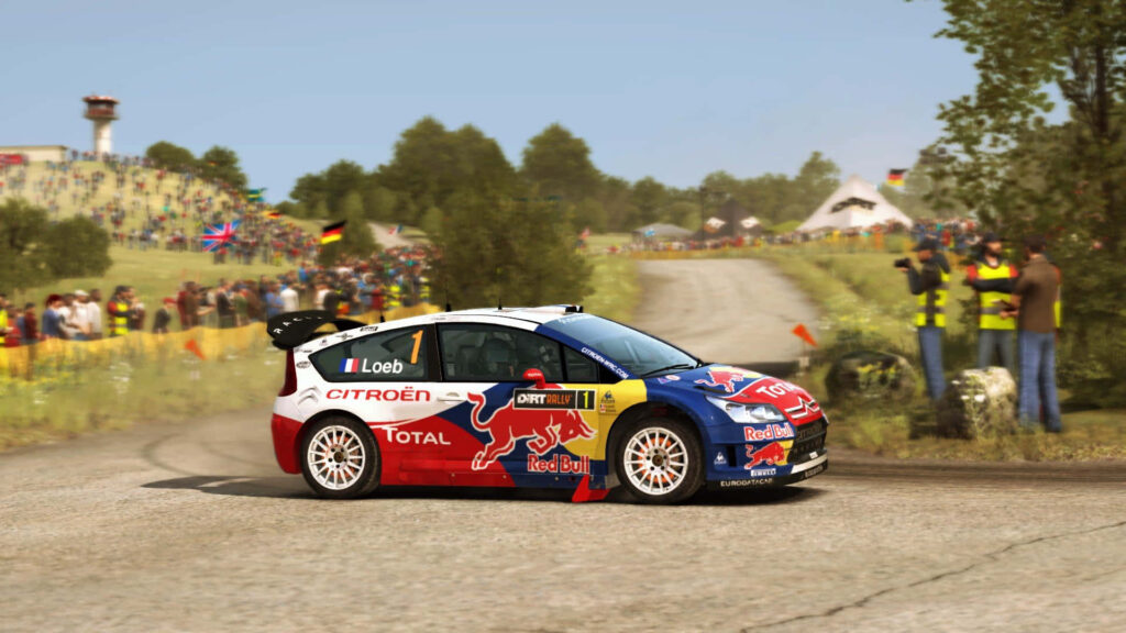 Thrilling Ride: Rally Car Conquers Majestic Mountain Terrain in a Stunning Backdrop Wallpaper
