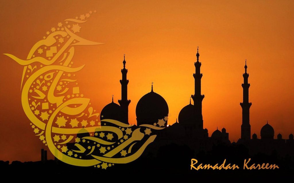 Golden crescent moon with Islamic calligraphy over Sheikh Zayed Mosque at orange sunset Ramadan wallpaper