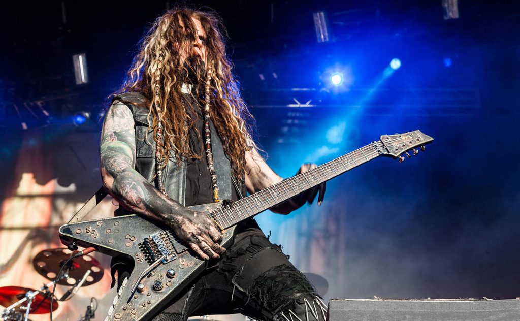Randy Weitzel In This Moment metal guitarist with V guitar dreadlocks tattoos blue stage lighting Wallpaper