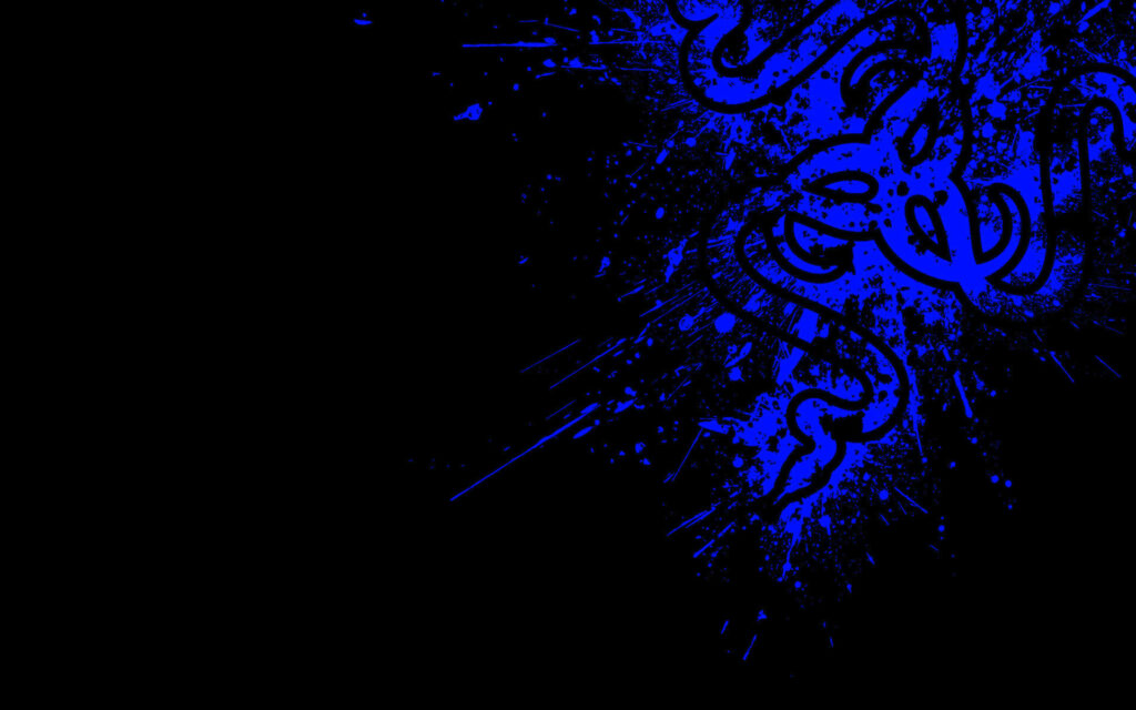 Inky Enigma: Razer PC Logo Emblazoned on a Stylish Blue Paint Splatter Background Wallpaper