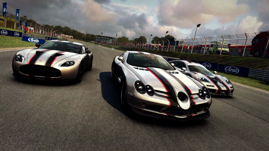 High-res Grid Autosport wallpaper with sports cars racing around sharp corner