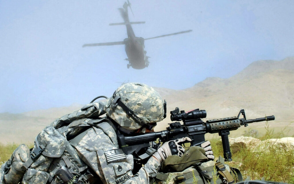 Ready for Combat: Close-up of US Military Soldier with Assault Rifle Wallpaper