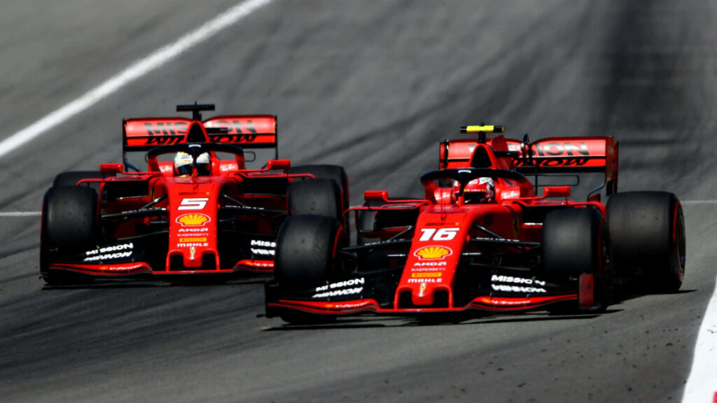 Revving up for Glory: The Fiery Red Fury of the Ferrari F1 Racing Powerhouse Wallpaper