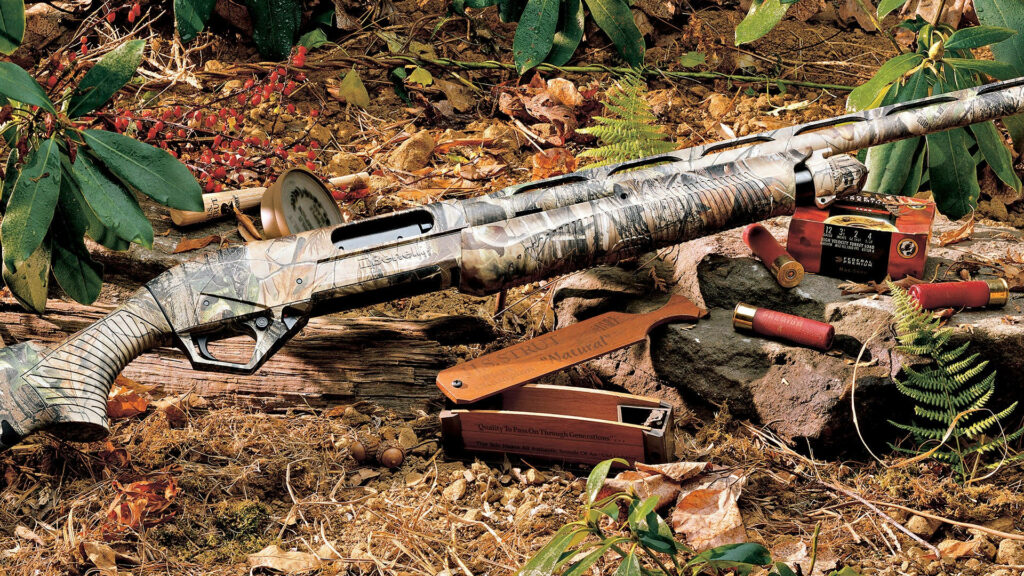 Sharp-eyed Marksman: An Expert Hunter Aiming with Precision Wallpaper