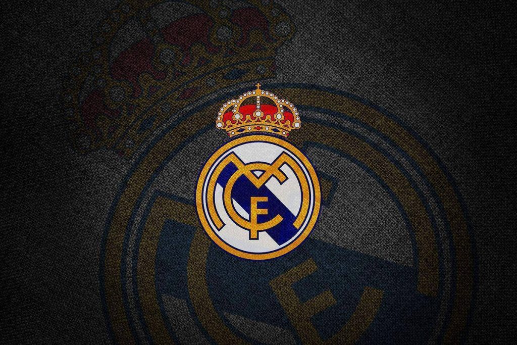 Real Madrid club crest wallpaper with vibrant detail on dark textured background for fans