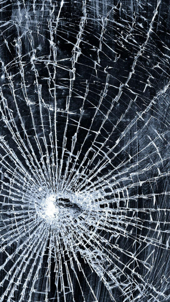 High-resolution broken screen wallpaper with realistic shattered glass cracks and dark background