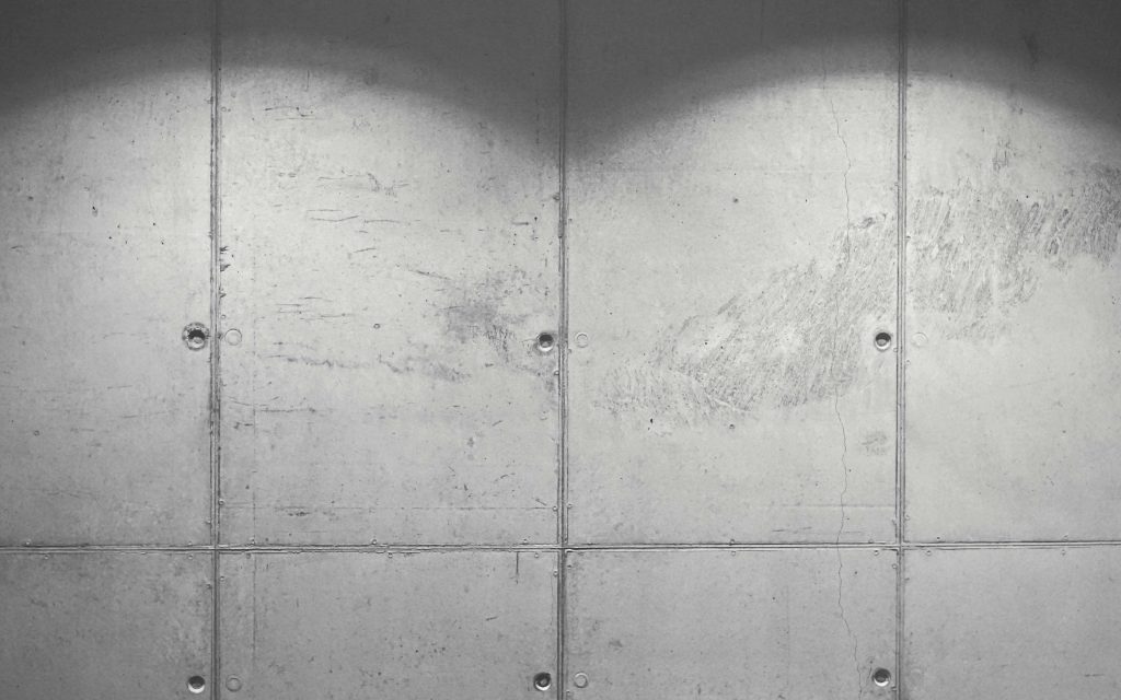 Realistic concrete wallpaper with industrial grid panels and soft diffused lighting background