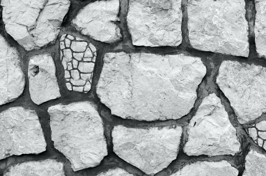 Realistic Cracked Stone Wallpaper: Aesthetic Concrete Texture Design