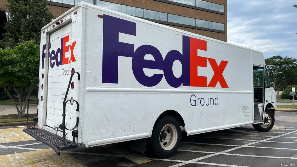 White FedEx Ground delivery truck with purple orange logo parked in a logistics lot wallpaper