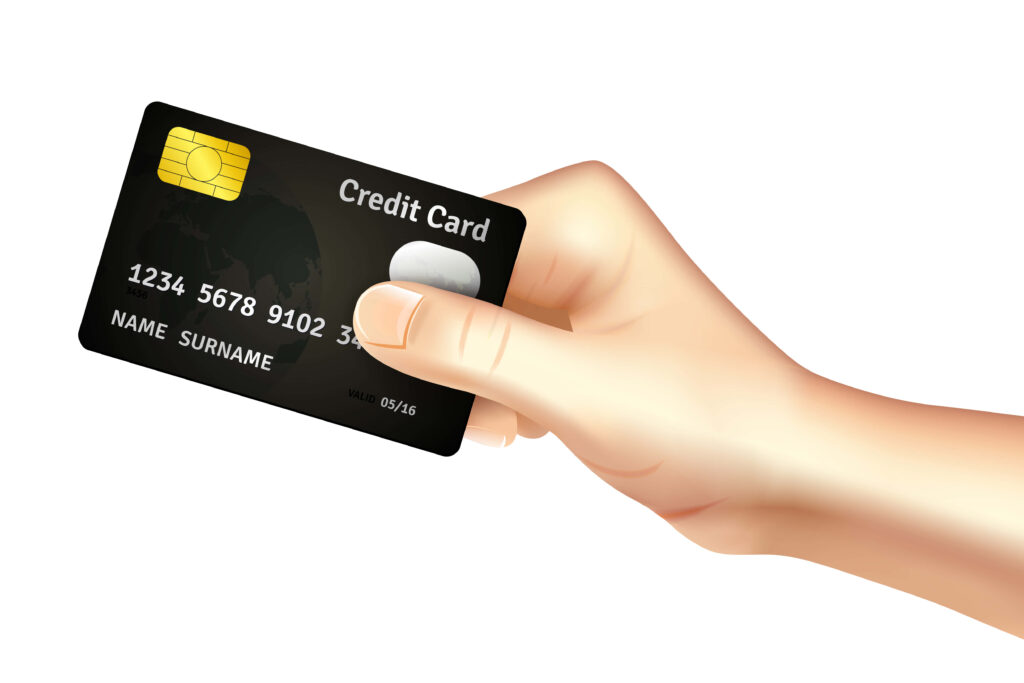 Hand holding black credit card on white background symbolizing modern digital payments and finance Wallpaper