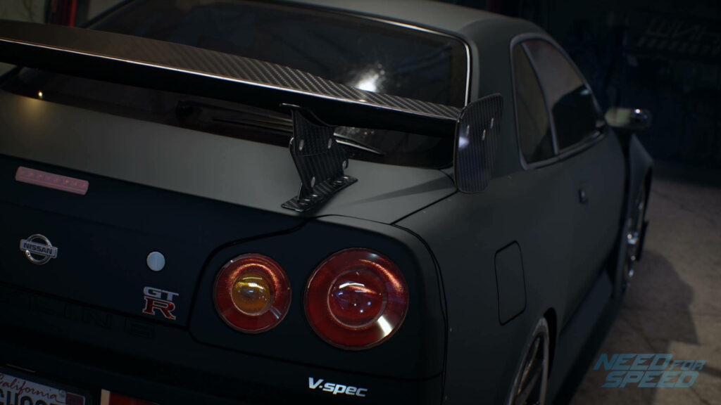 Matte black Nissan Skyline GTR R34 rear view bold body lines iconic tail lights garage scene Wallpaper