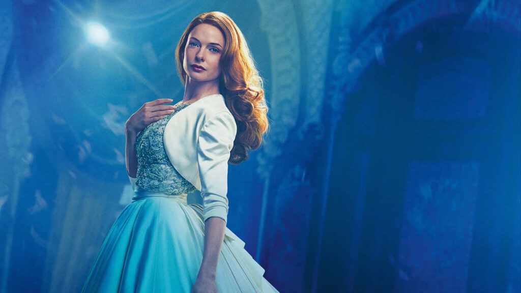 Rebecca Ferguson in elegant gown inside ornate opera house scene from The Greatest Showman wallpaper