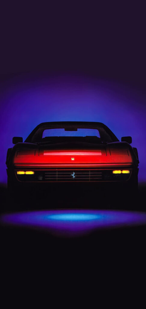 Red 1989 Ferrari 328 GTS front view wallpaper with sleek blue background for phone screens