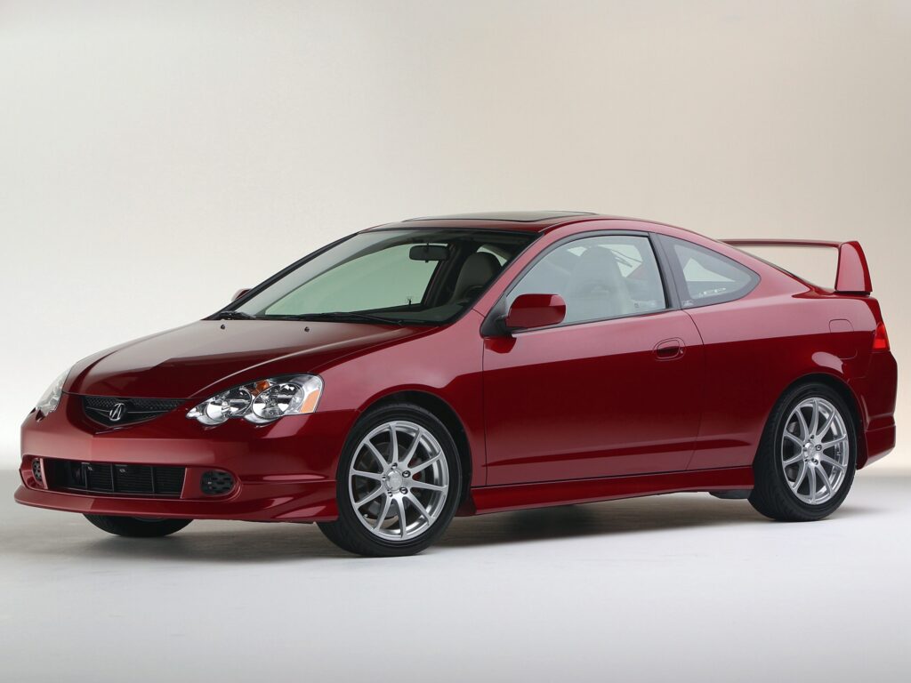 Sleek Red 2003 Acura RSX Front View Wallpaper on Neutral Background