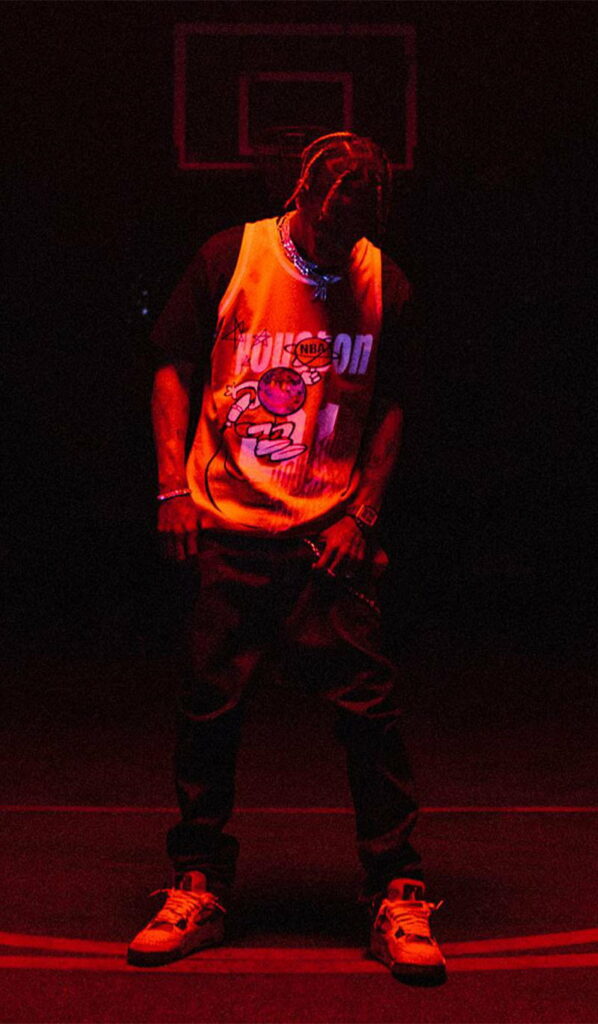 Vibrant Aesthetic: HD Red Phone Wallpaper of Travis Scott in front of Scott Wall