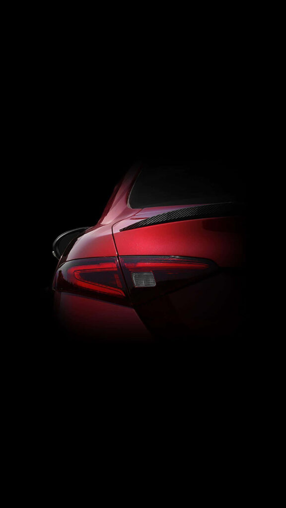 Close-up of red Alfa Romeo Giulia Sport Sedan rear showcasing sleek modern design wallpaper
