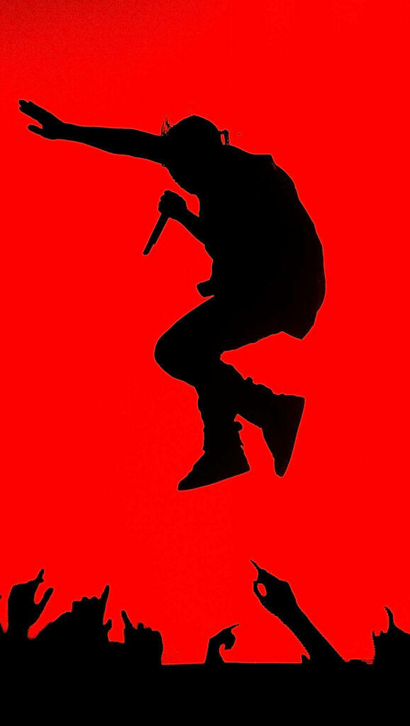 Reigning Red: Kanye West's Iconic Crowd Leap Captured in Android Wallpaper