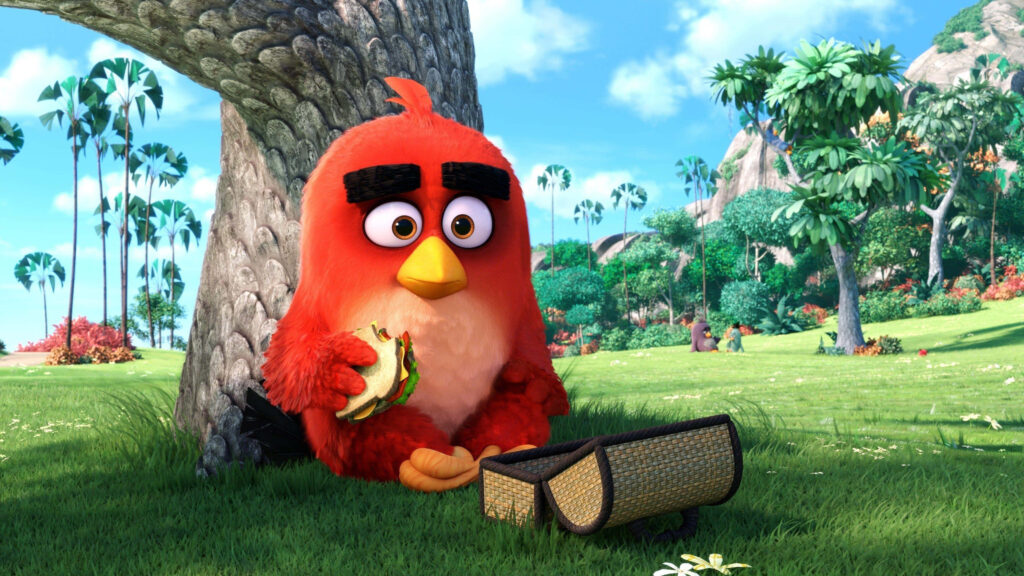 Red Angry Bird eating sandwich relaxing under tree vibrant outdoor wallpaper background