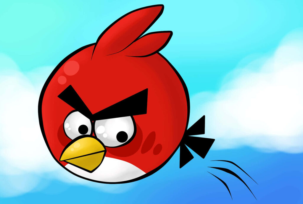 Red Angry Bird flying determinedly against bright blue sky with fluffy white clouds background Wallpaper