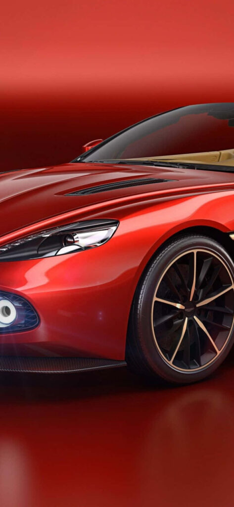 Red Aston Martin DB9 against matching red background showcasing sleek luxury design details Wallpaper