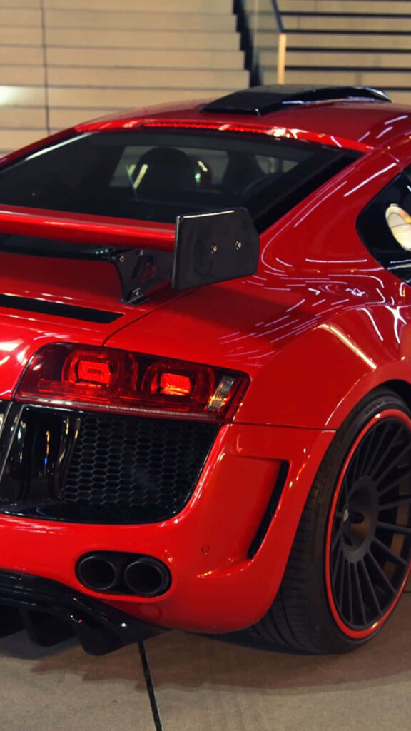 Close-up of sleek red Audi sports car rear design aggressive details perfect iPhone wallpaper background