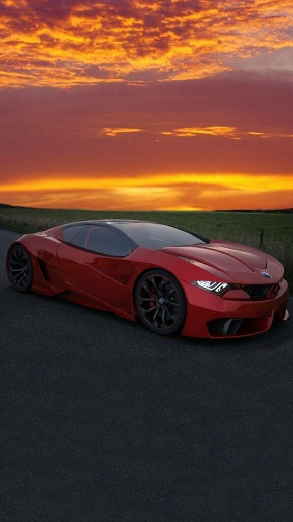 Red BMW M car on open road at dramatic sunset sky ideal for iPhone wallpaper background