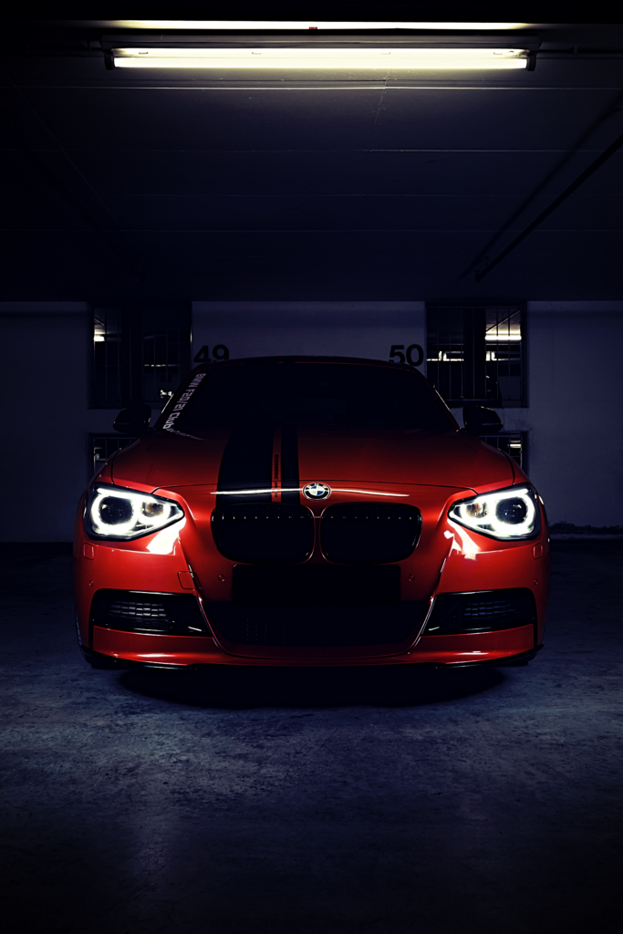 Red BMW M Performance Car Wallpaper - Urban Garage Elegance