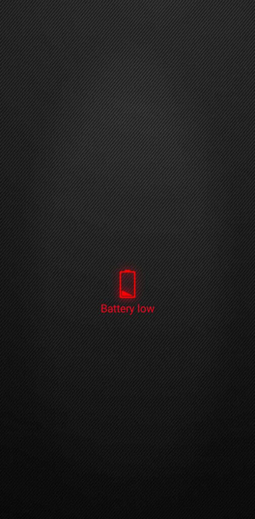 Red Battery Icon with Nearly Depleted Life Bar Against a Sleek Black Canvas Wallpaper