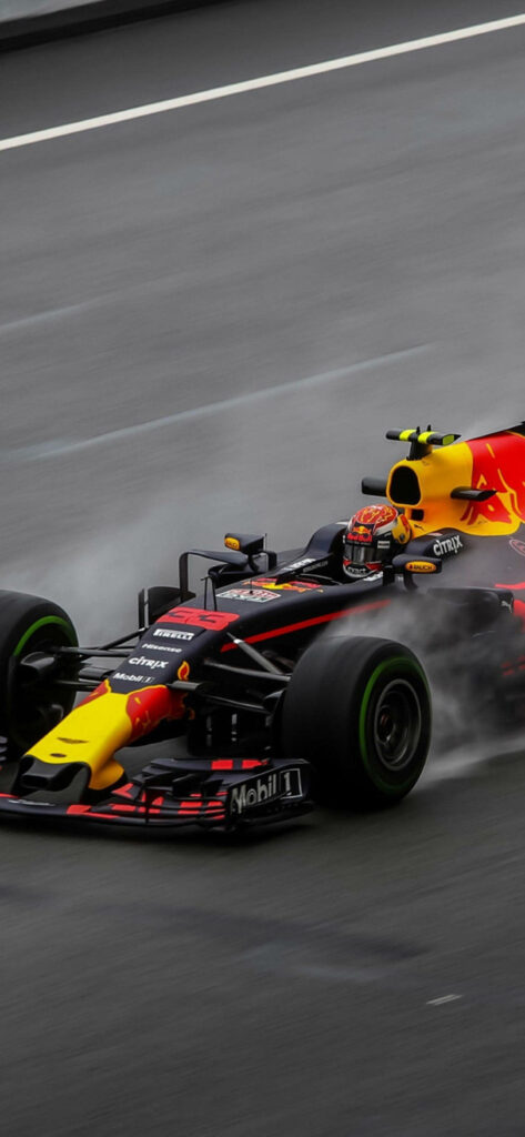 Red Bull Formula 1 car racing on wet track with spray high energy phone wallpaper background
