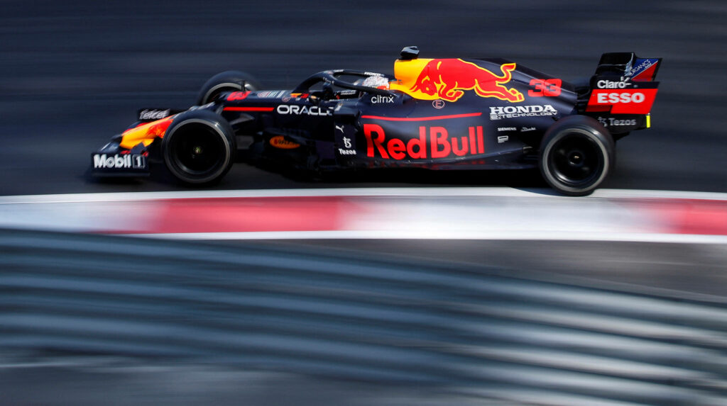 Red Bull Racing Formula 1 car speeding on track with vibrant colors dynamic motion wallpaper